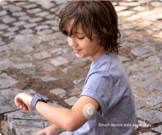 child checking thier glucose levels on thier smart watch - smart devices sold separatley