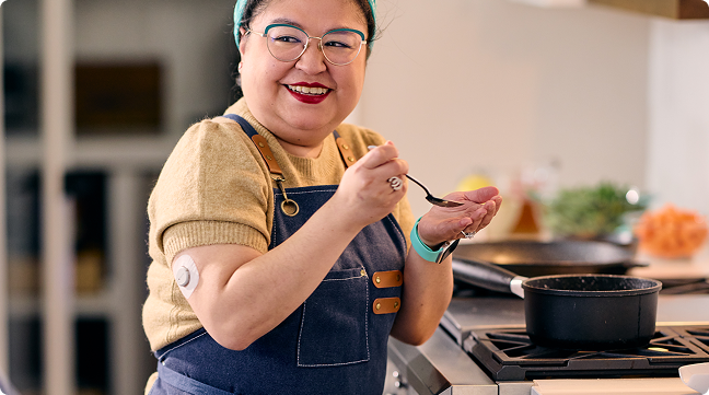 Gina tasting a dish 