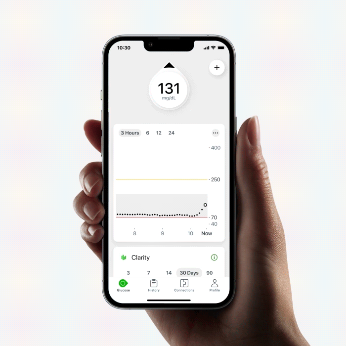 hand holding smartphone with dexcom app