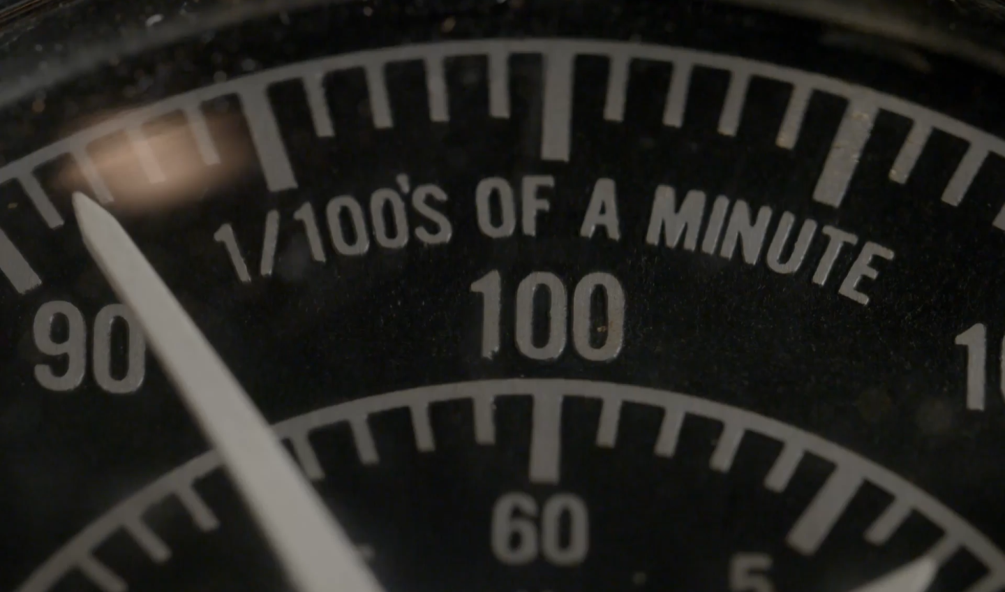Clock that says "1/100's of a minute"