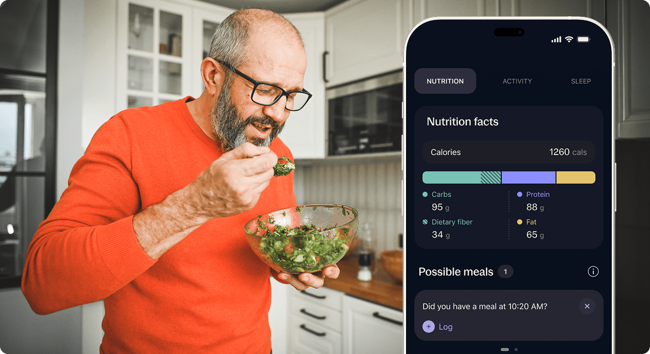 Person eating a salad that was logged in the Stelo app and shows its nutrition facts