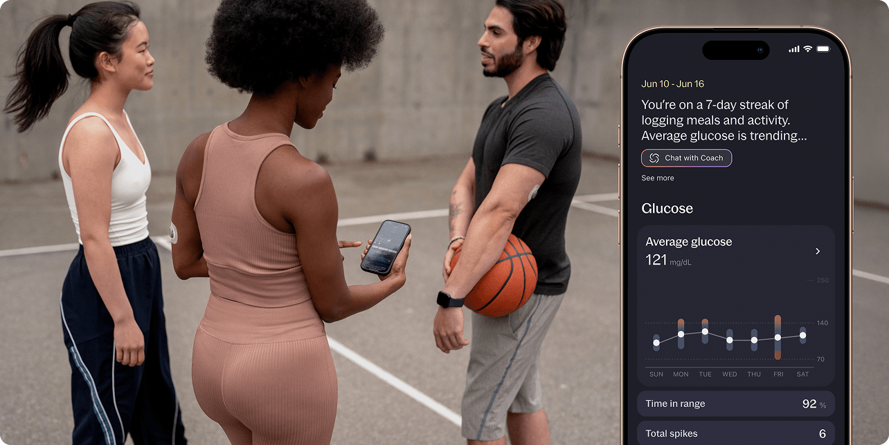 Woman playing basketball with friends and checking her average glucose reading